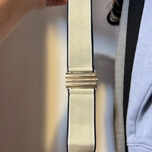 Tommy Hilfiger begs elastic belt with gold closure and blue /white stripe deisgn